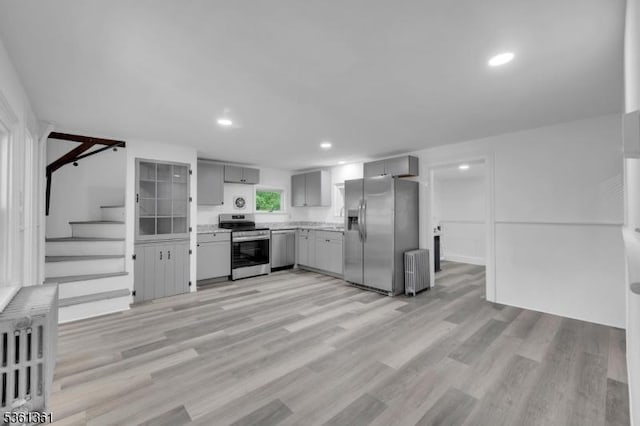 18 Ann St, Knowlton Twp, NJ 07832 - kitchen with stainless steel appliances, radiator heating unit, gray cabinetry, light countertops, and light wood-style flooring