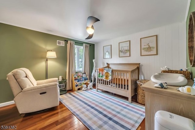 86 Belmont Ave, Cranford Twp, NJ 07016 - bedroom with wood finished floors, a nursery area, and ceiling fan