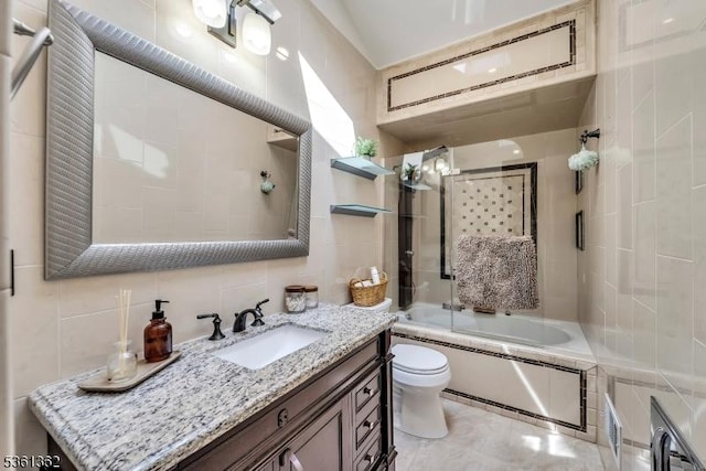 86 Belmont Ave, Cranford Twp, NJ 07016 - full bathroom with toilet, vanity, shower / bath combination with glass door, tile walls, and decorative backsplash