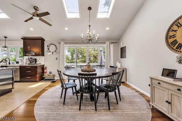 86 Belmont Ave, Cranford Twp, NJ 07016 - dining area with a skylight, ceiling fan, a chandelier, recessed lighting, and light wood-style floors