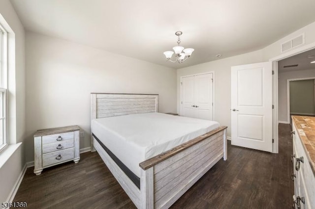 11 Woodland Way, Mount Arlington Boro, NJ 07856 - bedroom featuring dark wood-style flooring, a chandelier, baseboards, and a closet