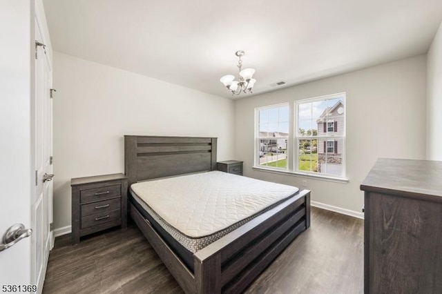11 Woodland Way, Mount Arlington Boro, NJ 07856 - bedroom with baseboards, dark wood-style floors, and a chandelier