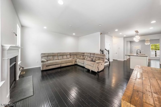 11 Woodland Way, Mount Arlington Boro, NJ 07856 - living area with dark wood-type flooring, a fireplace with raised hearth, baseboards, and recessed lighting