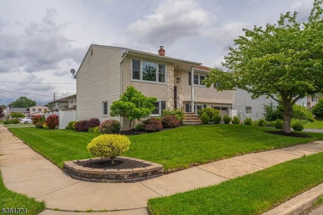 2507 Jay Pl, Union Twp, NJ 07083 - view of front facade with a chimney and a front yard