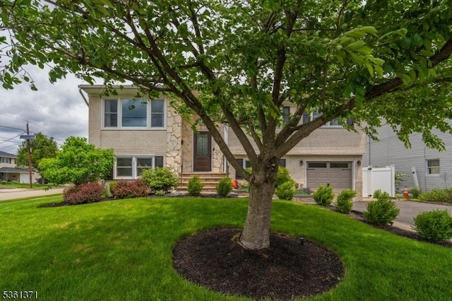 2507 Jay Pl, Union Twp, NJ 07083 - view of front of property with a front yard, a garage, brick siding, stone siding, and concrete driveway
