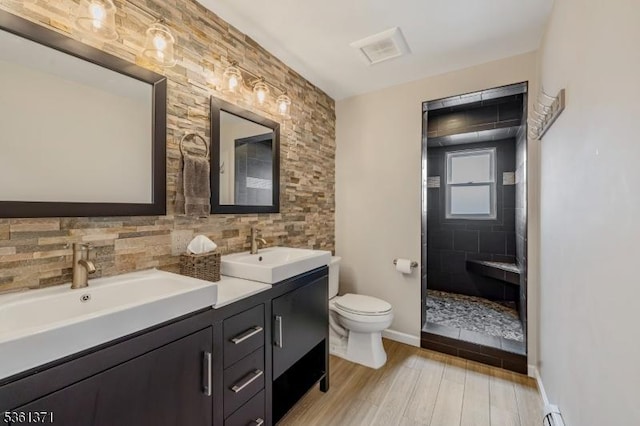 2507 Jay Pl, Union Twp, NJ 07083 - full bath featuring double vanity, toilet, wood finished floors, tasteful backsplash, and baseboards