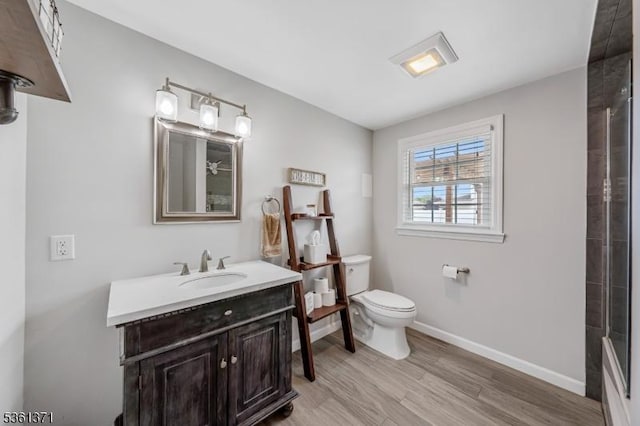 2507 Jay Pl, Union Twp, NJ 07083 - bathroom with toilet, wood finished floors, vanity, a shower, and baseboards