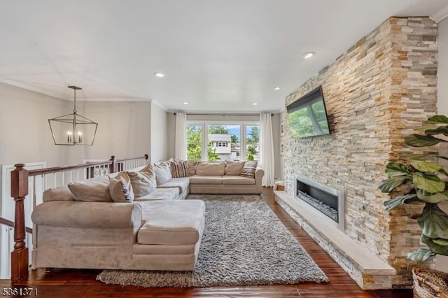 2507 Jay Pl, Union Twp, NJ 07083 - living room featuring a chandelier, dark wood-style floors, a fireplace, recessed lighting, and crown molding