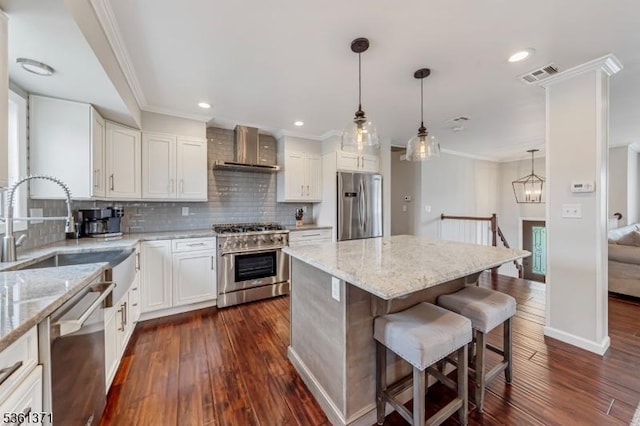 2507 Jay Pl, Union Twp, NJ 07083 - kitchen with stainless steel appliances, wall chimney exhaust hood, a sink, crown molding, and dark wood-style flooring