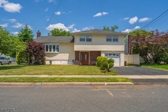 684 Garden St, Union Twp, NJ 07083 - tri-level home featuring a garage, driveway, and a chimney
