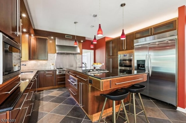 25 Castle Ct, Randolph Twp, NJ 07869 - kitchen with built in appliances, tasteful backsplash, a center island, wall chimney exhaust hood, and dark tile patterned floors