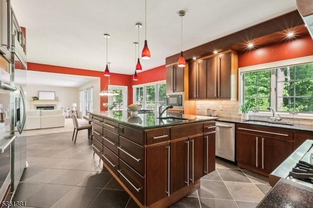 25 Castle Ct, Randolph Twp, NJ 07869 - kitchen featuring a sink, appliances with stainless steel finishes, decorative backsplash, and open floor plan