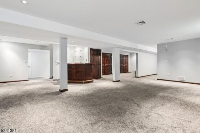 25 Castle Ct, Randolph Twp, NJ 07869 - unfurnished living room with light carpet, baseboards, recessed lighting, and bar area