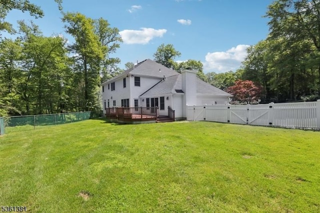 25 Castle Ct, Randolph Twp, NJ 07869 - rear view of house featuring a gate, a wooden deck, and a chimney