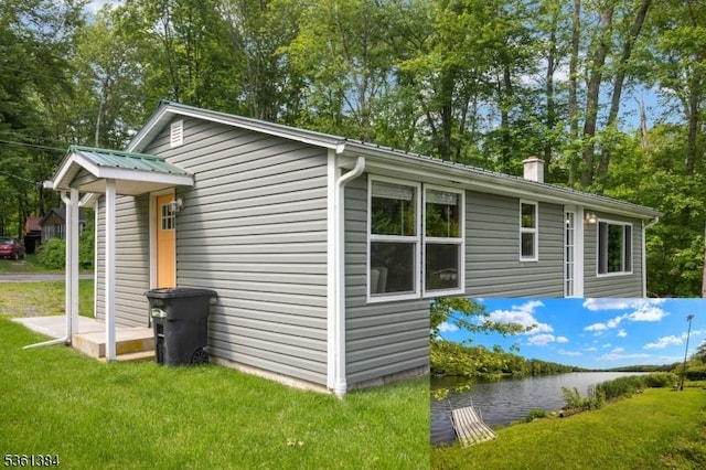 31 Plaza Dr, Hampton Twp, NJ 07860 - view of property exterior featuring a water view, a lawn, and a chimney
