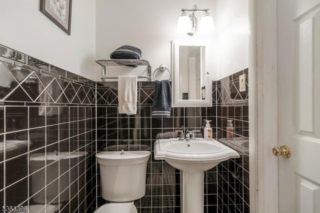 22 Messig Rd, Clinton Town, NJ 08809 - half bathroom featuring tile walls, toilet, and a wainscoted wall