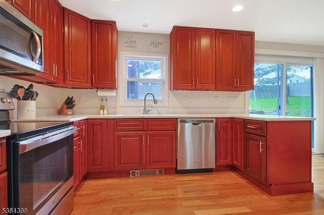 29 Black Oak Dr, Vernon Twp, NJ 07462 - kitchen with stainless steel appliances, a sink, plenty of natural light, light wood finished floors, and recessed lighting