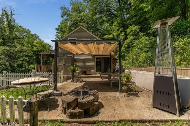 115 Stephensburg Rd, Washington Twp, NJ 07865 - back of property featuring an outdoor fire pit and a patio area