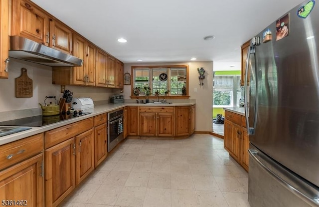 115 Stephensburg Rd, Washington Twp, NJ 07865 - kitchen featuring appliances with stainless steel finishes, under cabinet range hood, brown cabinetry, light countertops, and recessed lighting