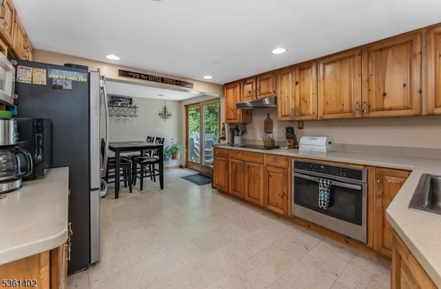 115 Stephensburg Rd, Washington Twp, NJ 07865 - kitchen with stainless steel appliances, brown cabinets, under cabinet range hood, recessed lighting, and light countertops