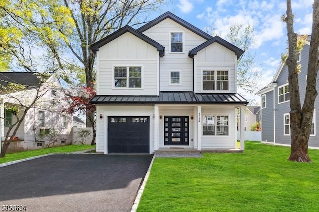 1314 Pine Grove Ave, Westfield Town, NJ 07090 - view of front facade with board and batten siding, a standing seam roof, a front lawn, and driveway
