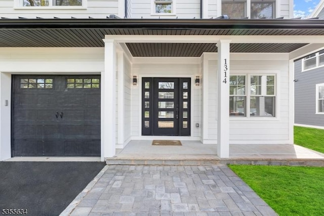 1314 Pine Grove Ave, Westfield Town, NJ 07090 - view of exterior entry with a garage and covered porch