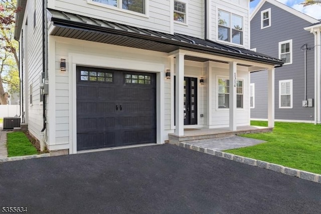 1314 Pine Grove Ave, Westfield Town, NJ 07090 - view of exterior entry featuring a standing seam roof, central air condition unit, metal roof, and a porch