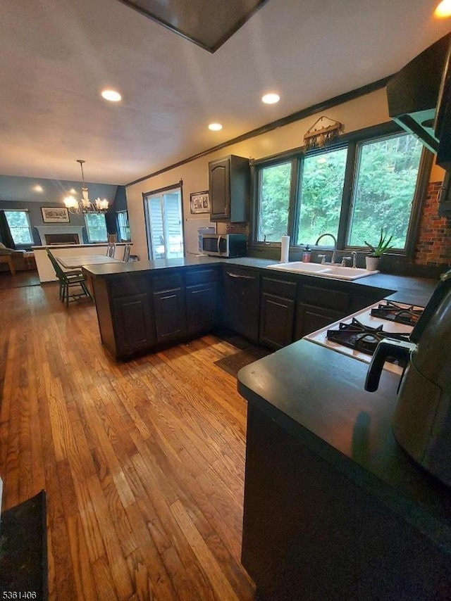 4 Babbitt Ct, Newton Town, NJ 07860 - kitchen with a peninsula, a sink, plenty of natural light, crown molding, and recessed lighting