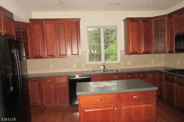 7 Troon Dr, Fredon Twp, NJ 07860 - kitchen with black appliances, reddish brown cabinets, a sink, and glass insert cabinets