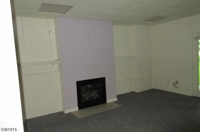 7 Troon Dr, Fredon Twp, NJ 07860 - unfurnished living room with carpet floors, a fireplace with flush hearth, and a drop ceiling