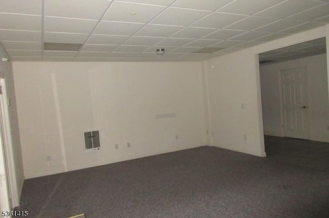 7 Troon Dr, Fredon Twp, NJ 07860 - empty room featuring dark colored carpet, heating unit, and a drop ceiling