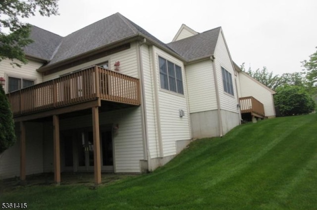 7 Troon Dr, Fredon Twp, NJ 07860 - back of property featuring a wooden deck and a lawn