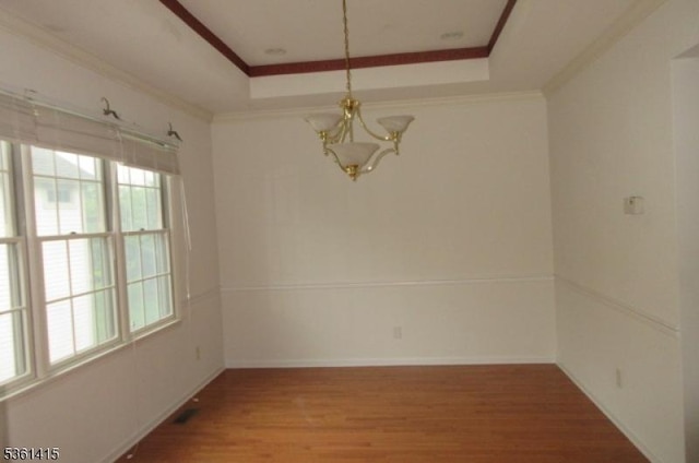 7 Troon Dr, Fredon Twp, NJ 07860 - unfurnished dining area with a chandelier, a raised ceiling, wood finished floors, ornamental molding, and baseboards