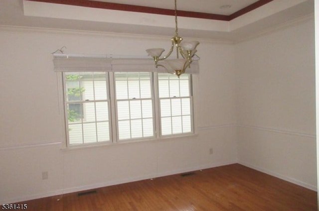 7 Troon Dr, Fredon Twp, NJ 07860 - spare room featuring a chandelier, plenty of natural light, wood finished floors, a tray ceiling, and crown molding