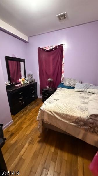 28 1st St, Elizabeth City, NJ 07206 - bedroom with wood finished floors