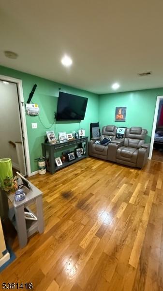28 1st St, Elizabeth City, NJ 07206 - living area featuring wood finished floors and recessed lighting
