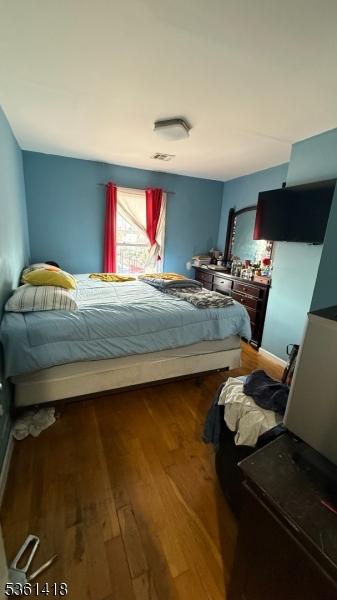 28 1st St, Elizabeth City, NJ 07206 - bedroom featuring wood finished floors