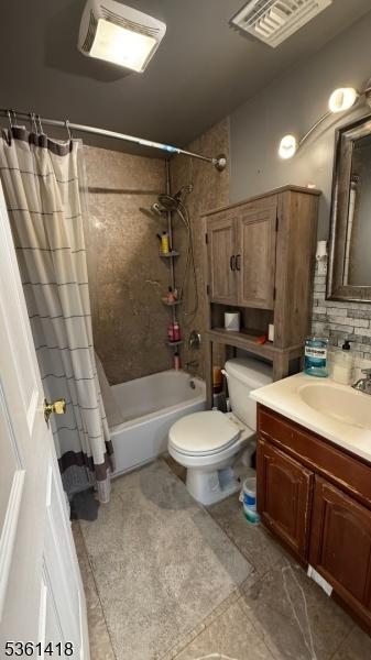 28 1st St, Elizabeth City, NJ 07206 - full bathroom with shower / tub combo with curtain, vanity, toilet, and tasteful backsplash