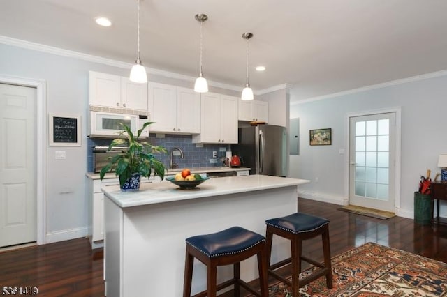 50 Skillman Rd, Montgomery Twp, NJ 08558 - kitchen featuring freestanding refrigerator, dark wood-style floors, baseboards, crown molding, and white cabinets