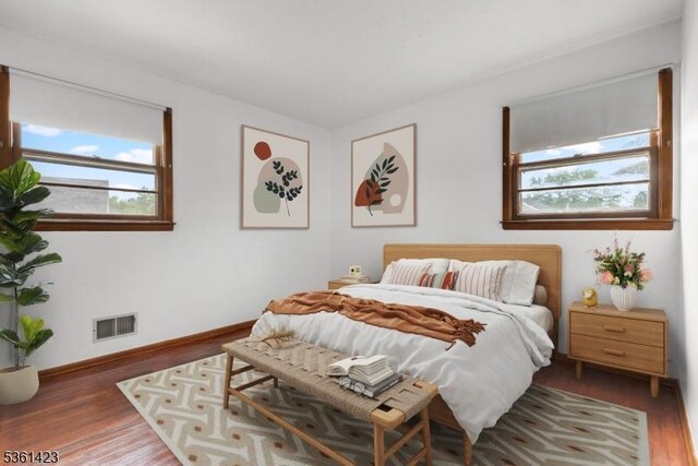 3 Gregory Ter, Belleville Twp, NJ 07109 - bedroom featuring multiple windows, wood finished floors, and baseboards