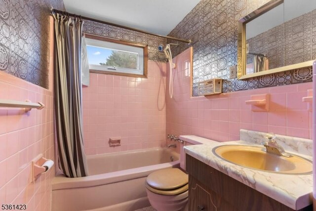 3 Gregory Ter, Belleville Twp, NJ 07109 - bathroom featuring tile walls, shower / bath combo with shower curtain, toilet, and vanity
