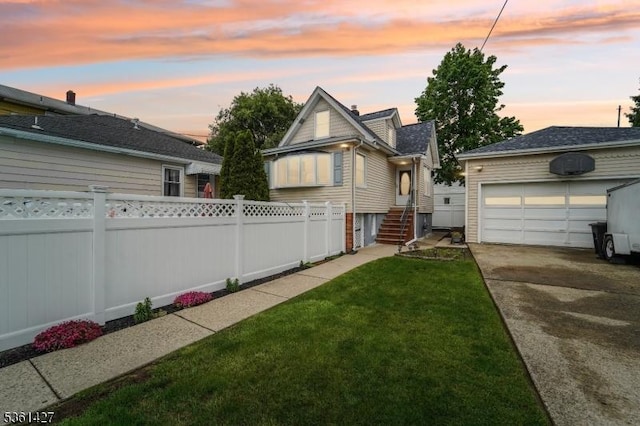 30 Market St, Garfield City, NJ 07026 - view of front of home with a garage, driveway, and an outdoor structure
