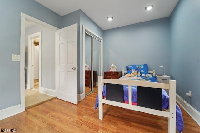 30 Market St, Garfield City, NJ 07026 - bedroom with light wood finished floors, baseboards, and a closet