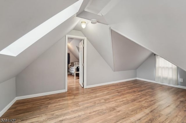 30 Market St, Garfield City, NJ 07026 - bonus room featuring a skylight, lofted ceiling, wood finished floors, and baseboards