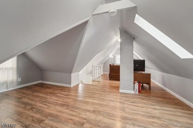 30 Market St, Garfield City, NJ 07026 - additional living space featuring a skylight, lofted ceiling, wood finished floors, and baseboards