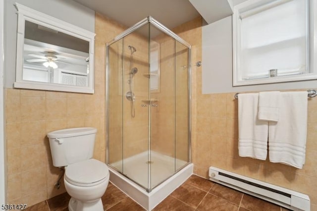 30 Market St, Garfield City, NJ 07026 - bathroom with a baseboard heating unit, tile walls, a stall shower, toilet, and tile patterned floors