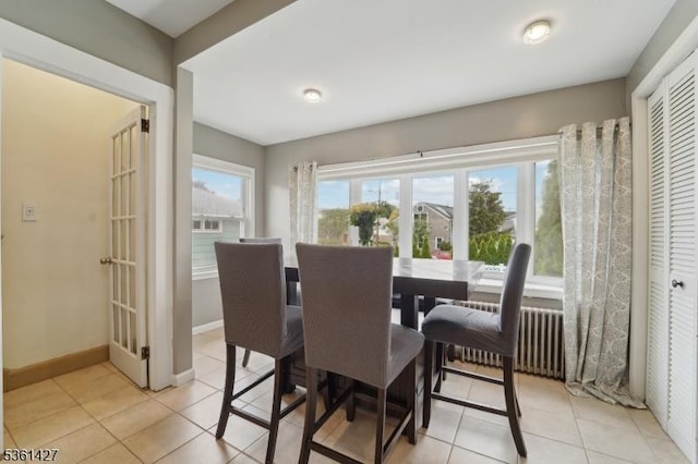 30 Market St, Garfield City, NJ 07026 - dining space with plenty of natural light, light tile patterned flooring, and radiator