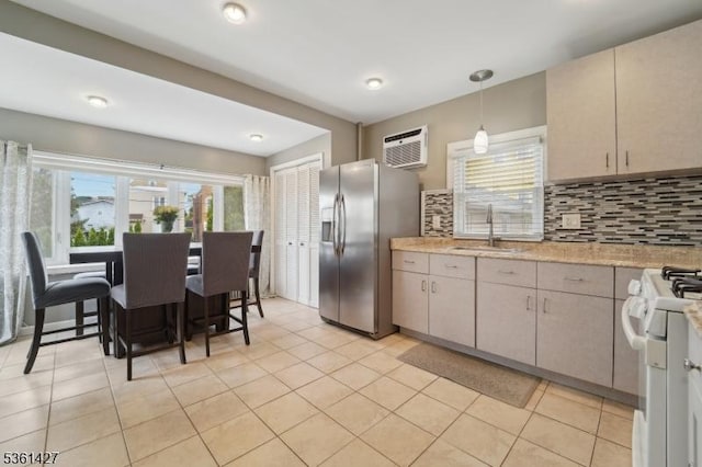 30 Market St, Garfield City, NJ 07026 - kitchen with a sink, stainless steel fridge, gas range gas stove, light countertops, and backsplash