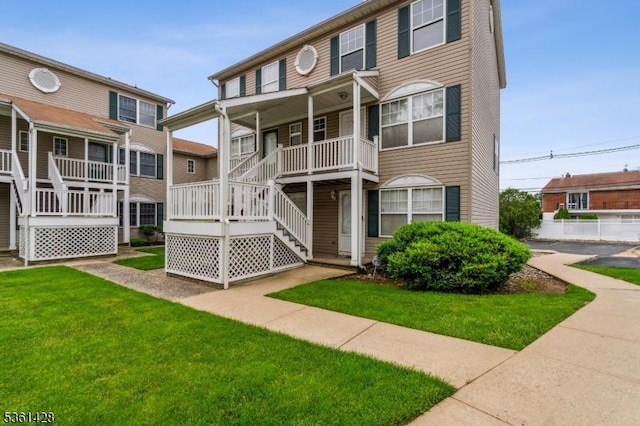 239 40th St Unit 7, Irvington Twp, NJ 07111 - view of front of property with a front lawn and stairs