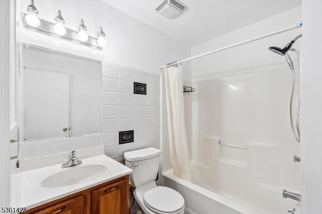 239 40th St Unit 7, Irvington Twp, NJ 07111 - bathroom with toilet, vanity, shower / bath combo, and tile walls